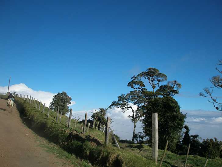 Cowboy riding up the volcano road